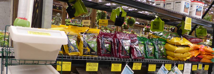 bags of grass seed on a shelf